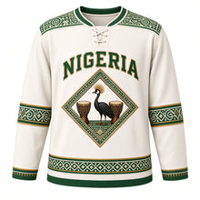 Load image into Gallery viewer, Nigeria Original Hockey Jersey in Harmattan White, front view – adire-pattern yoke and diamond crowned-crane Zuma Rock crest in ornate detailed artwork, custom name and number