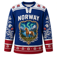Load image into Gallery viewer, Norway Original Hockey Jersey in Fjord Blue, front view – Selbu-rose knit yoke and rosemaling fjord-horse crest in ornate detailed artwork, custom name and number