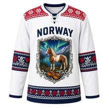 Load image into Gallery viewer, Norway Original Hockey Jersey in Snowfield White, front view – Selbu-rose knit yoke and rosemaling fjord-horse crest in ornate detailed artwork, custom name and number