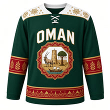 Load image into Gallery viewer, Oman Original Hockey Jersey in Jebel Green, front view – kumma-embroidery yoke and octagonal oryx Nizwa Fort crest in ornate detailed artwork, custom name and number