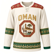 Load image into Gallery viewer, Oman Original Hockey Jersey in Frankincense White, front view – kumma-embroidery yoke and octagonal oryx Nizwa Fort crest in ornate detailed artwork, custom name and number