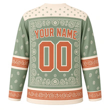 Load image into Gallery viewer, Paisley Bandana Original Hockey Jersey in Sage Prairie, back view with your name and number – dot-and-diamond yoke and paisley border sleeve stripes
