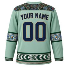 Load image into Gallery viewer, Pakistan Original Hockey Jersey in Indus Mint, back view with your name and number – Sindhi ajrak yoke and Multani blue-pottery sleeve bands