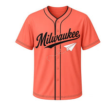 Load image into Gallery viewer, Paper Airplane Milwaukee Baseball Jersey in Sunset Coral, front view – folded paper airplane with dashed loop flight trail graphic with cloud crest, custom name and number