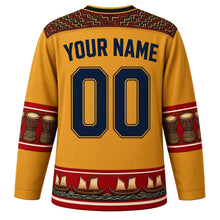 Load image into Gallery viewer, Papua New Guinea Original Hockey Jersey in Birdwing Gold, back view with your name and number – bilum-weave yoke and kundu-drum sleeve bands
