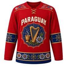 Load image into Gallery viewer, Paraguay Original Hockey Jersey in Guarani Red, front view – ñandutí lace harp crest and ao po'i embroidery yoke with ornate detailed artwork, custom name and number