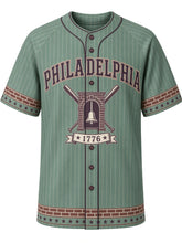 Load image into Gallery viewer, Philadelphia Heritage Baseball Jersey in Verdigris, front view – verdigris green pinstripe body with cream wordmark and brick-band trim, arched PHILADELPHIA wordmark, bell-in-brick-archway emblem with crossed bats and a 1776 ribbon – custom name and number