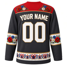 Load image into Gallery viewer, Poland Original Hockey Jersey in Tatra Charcoal, back view with your name and number – Zalipie flower yoke and wycinanki cut-paper sleeve bands