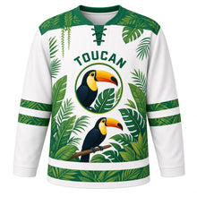 Load image into Gallery viewer, Rainforest Toucan Original Hockey Jersey in Rain Mist White, front view – bright toucan perched among tropical rainforest leaves with toucan crest, custom name and number