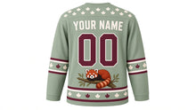 Load image into Gallery viewer, Red Panda Treetop Original Hockey Jersey in Sage Mist, back view with your name and number – maple-leaf yoke and ringed-tail sleeve bands
