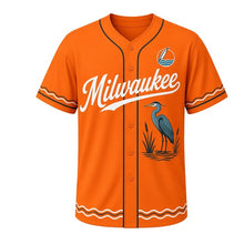 Load image into Gallery viewer, River Heron Milwaukee Baseball Jersey in Riverbank Sunset Orange, front view – great blue heron and cattails graphic with feather-and-wave crest, custom name and number