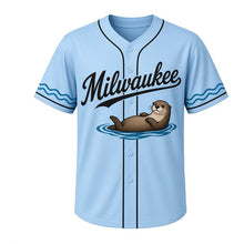 Load image into Gallery viewer, River Otter Milwaukee Baseball Jersey in Clear Sky Blue, front view – floating river otter graphic with river-stone crest, custom name and number