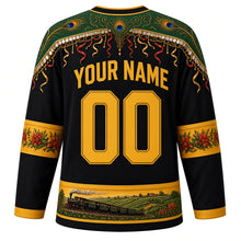 Load image into Gallery viewer, Saint Kitts and Nevis Original Hockey Jersey in Brimstone Black, back view with your name and number – masquerade-pattern yoke and flamboyant blossom sleeve bands