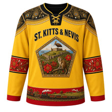 Load image into Gallery viewer, Saint Kitts and Nevis Original Hockey Jersey in Sunshine Gold, front view – Sugar Mas masquerade yoke and Brimstone Hill bastion crest with ornate detailed artwork, custom name and number