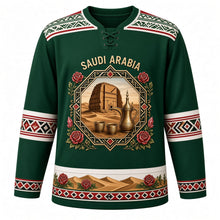 Load image into Gallery viewer, Saudi Arabia Original Hockey Jersey in Najd Green, front view – Al-Qatt geometric yoke and octagonal AlUla Elephant Rock crest with ornate detailed artwork, custom name and number