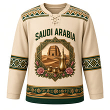 Load image into Gallery viewer, Saudi Arabia Original Hockey Jersey in Dune Sand, front view – Al-Qatt geometric yoke and octagonal AlUla Elephant Rock crest with ornate detailed artwork, custom name and number