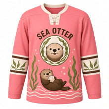 Load image into Gallery viewer, Sea Otter Kelp Forest Original Hockey Jersey in Coral Dusk, front view – sea otter floating among kelp with a seashell and sea-otter crest, custom name and number