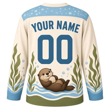 Load image into Gallery viewer, Sea Otter Kelp Forest Original Hockey Jersey in Sea Foam Cream, back view with your name and number – bubble-pattern yoke and kelp-stripe sleeve bands