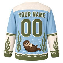 Load image into Gallery viewer, Sea Otter Kelp Forest Original Hockey Jersey in Pacific Blue, back view with your name and number – bubble-pattern yoke and kelp-stripe sleeve bands
