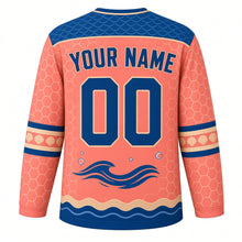 Load image into Gallery viewer, Sea Turtle Voyage Original Hockey Jersey in Coral Sunset, back view with your name and number – wave-scallop yoke and shell-pattern sleeve stripes