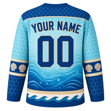 Load image into Gallery viewer, Sea Turtle Voyage Original Hockey Jersey in Reef Turquoise, back view with your name and number – wave-scallop yoke and shell-pattern sleeve stripes