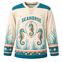 Load image into Gallery viewer, Seahorse Reef Original Hockey Jersey in Pearl Sand, front view – two curly-tailed seahorses among sea grass with seahorse crest, custom name and number