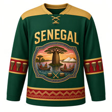 Load image into Gallery viewer, Senegal Original Hockey Jersey in Baobab Green, front view – baobab and painted-pirogue cartouche crest under SENEGAL lettering, ornate indigo-pattern yoke and detailed artwork, custom name and number