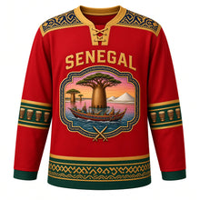 Load image into Gallery viewer, Senegal Original Hockey Jersey in Teranga Red, front view – baobab and painted-pirogue cartouche crest under SENEGAL lettering, ornate indigo-pattern yoke and detailed artwork, custom name and number