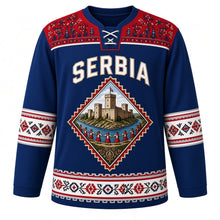 Load image into Gallery viewer, Serbia Original Hockey Jersey in Danube Blue, front view – Golubac Fortress and kolo-dancer diamond crest under SERBIA lettering, ornate Pirot kilim yoke and detailed artwork, custom name and number