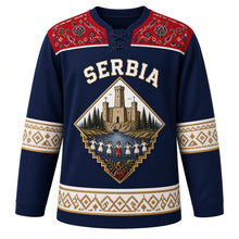Load image into Gallery viewer, Serbia Original Hockey Jersey in Morava Navy, front view – Golubac Fortress and kolo-dancer diamond crest under SERBIA lettering, ornate Pirot kilim yoke and detailed artwork, custom name and number