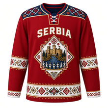 Load image into Gallery viewer, Serbia Original Hockey Jersey in Kilim Red, front view – Golubac Fortress and kolo-dancer diamond crest under SERBIA lettering, ornate Pirot kilim yoke and detailed artwork, custom name and number