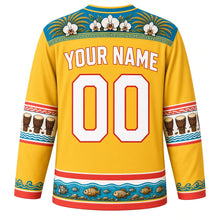 Load image into Gallery viewer, Seychelles Original Hockey Jersey in Sunshine Yellow, back view with your name and number – coco de mer frond and orchid yoke with moutya-drum sleeve bands