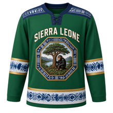 Load image into Gallery viewer, Sierra Leone Original Hockey Jersey in Lion Mountain Green, front view – Cotton Tree and Lion Mountains octagon crest under SIERRA LEONE lettering, ornate country-cloth yoke and detailed artwork, custom name and number