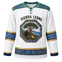 Load image into Gallery viewer, Sierra Leone Original Hockey Jersey in Freetown White, front view – Cotton Tree and Lion Mountains octagon crest under SIERRA LEONE lettering, ornate country-cloth yoke and detailed artwork, custom name and number