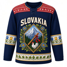 Load image into Gallery viewer, Slovakia Original Hockey Jersey in Tatra Night Navy, front view – Cicmany folk-ornament yoke and diamond crest with Krivan peak and fujara flute, ornate detailed artwork, custom name and number
