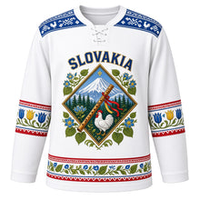 Load image into Gallery viewer, Slovakia Original Hockey Jersey in Tatra Snow White, front view – Cicmany folk-ornament yoke and diamond crest with Krivan peak and fujara flute, ornate detailed artwork, custom name and number