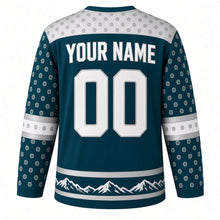Load image into Gallery viewer, Snow Leopard Peaks Original Hockey Jersey in Frost Teal, back view with your name and number – rosette-spot yoke and mountain-silhouette hem stripes