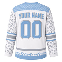 Load image into Gallery viewer, Snow Leopard Peaks Original Hockey Jersey in Snowfield White, back view with your name and number – rosette-spot yoke and mountain-silhouette hem stripes