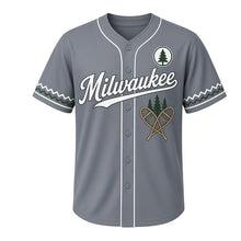 Load image into Gallery viewer, Snowshoe Trail Milwaukee Baseball Jersey in Slate Gray, front view – crossed wooden snowshoes and pine trees graphic with pine-tree crest, custom name and number