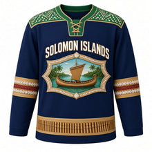 Load image into Gallery viewer, Solomon Islands Original Hockey Jersey in Lagoon Blue, front view – mother-of-pearl inlay yoke and canoe-shaped crest with tomoko canoe and panpipes, ornate detailed artwork, custom name and number