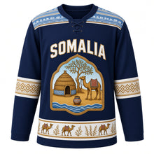Load image into Gallery viewer, Somalia Original Hockey Jersey in Indian Ocean Navy, front view – alindi-stripe yoke and aqal-dome crest with camel, frankincense tree and dhiil vessel, ornate detailed artwork, custom name and number