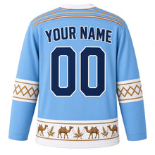 Load image into Gallery viewer, Somalia Original Hockey Jersey in Somali Sky Blue, back view with your name and number – alindi woven-stripe yoke and aqal-mat sleeve bands