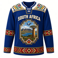 Load image into Gallery viewer, South Africa Original Hockey Jersey in Cape Blue, front view – Ndebele-pattern yoke and stepped-gable crest with Table Mountain, baobab and blue crane, ornate detailed artwork, custom name and number