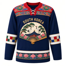 Load image into Gallery viewer, South Korea Original Hockey Jersey in Joseon Blue, front view – dancheong yoke and folding-fan crane and mugunghwa crest with ornate detailed artwork, custom name and number