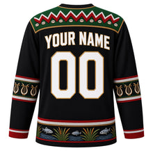 Load image into Gallery viewer, South Sudan Original Hockey Jersey in Cattle Camp Black, back view with your name and number – Dinka beadwork yoke and cattle-horn sleeve bands