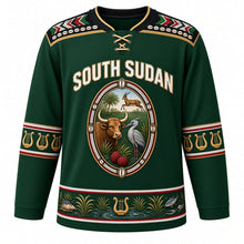 Load image into Gallery viewer, South Sudan Original Hockey Jersey in Sudd Green, front view – ornate beaded oval crest with long-horned bull, shoebill and kob, Dinka beadwork yoke, detailed artwork, custom name and number