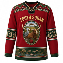 Load image into Gallery viewer, South Sudan Original Hockey Jersey in Beadwork Red, front view – ornate beaded oval crest with long-horned bull, shoebill and kob, Dinka beadwork yoke, detailed artwork, custom name and number