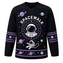 Load image into Gallery viewer, Spacewalk Explorer Original Hockey Jersey in Cosmic Black, front view – floating astronaut on a tether with ringed planet and astronaut-helmet crest, custom name and number