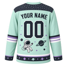Load image into Gallery viewer, Spacewalk Explorer Original Hockey Jersey in Orbit Mint, back view with your name and number – star-pattern yoke and orbit-ring sleeve bands