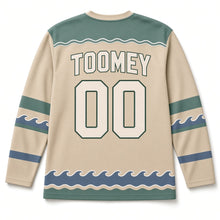 Load image into Gallery viewer, Sea Cliffs Lighthouse St. Patrick's Day Hockey Jersey in Coast Sand, back view with your name and number